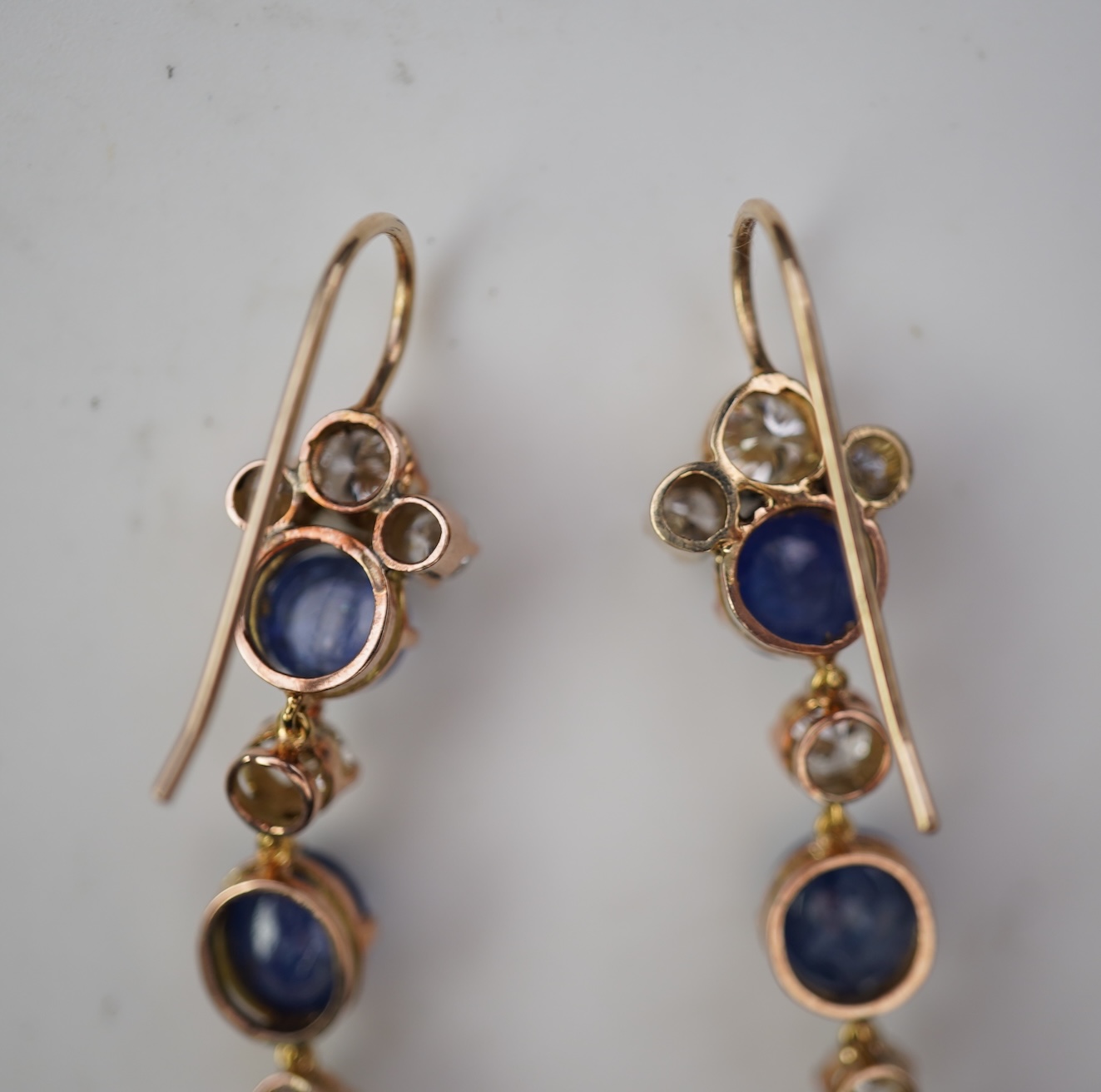A pair of sapphire and diamond drop earrings